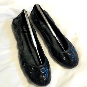 Tory Burch black sparkle packable Flats.